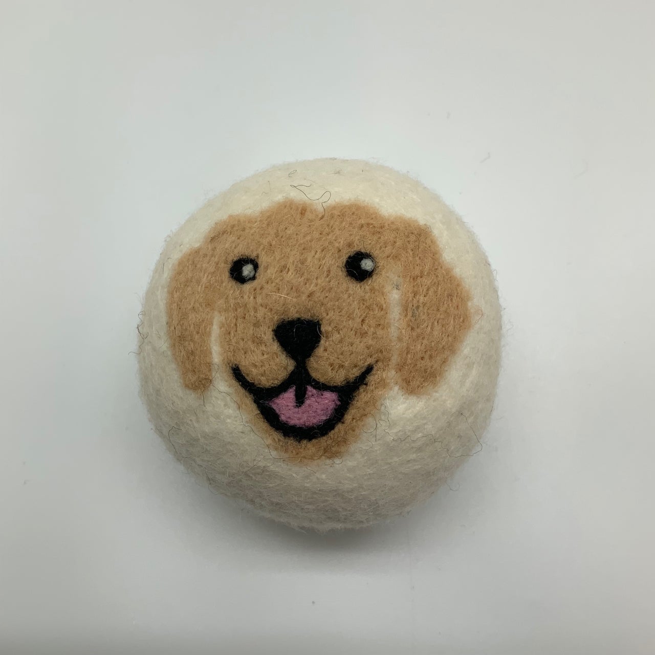 Dryer ball-happy dog